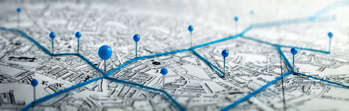 Routes with blue pins on a city map. Concept on the adventure, discovery, navigation, communication, logistics, geography, transport and travel topics. © Tryfonov