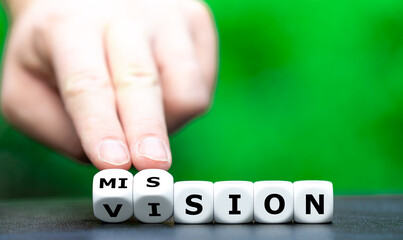 From a vision to a mission. Dice form the words vision and mission. - obrazy, fototapety, plakaty