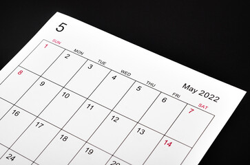 May 2022 calendar sheet on black background.