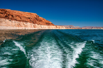 Cruise along Lake Powell. View of narrow, cliff-lined canyon from a boat in Glen Canyon National Recreation Area, Arizona..