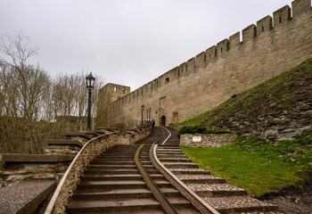 Fototapeta na wymiar stairs leading to the fortress. Fortress wall Ivangorod. Ivangorod fortress. History of Russia.