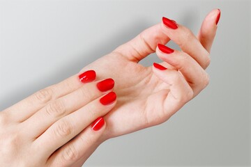 Elegant female hands with fresh manicure. Spa or wellness card.