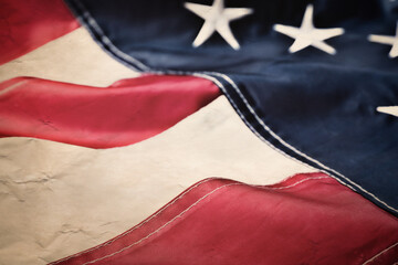 Old American flag as background, closeup view. National symbol of USA