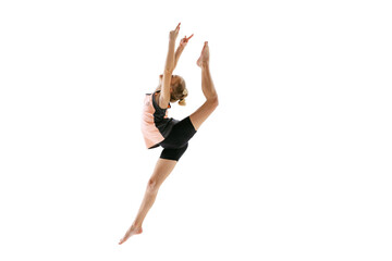 Little flexible girl, rhythmic gymnastics artist jumping isolated on white studio background. Grace...