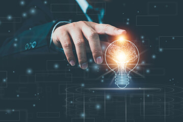 Light bulb with brain inside the hands of the businessman and point connecting network on blue background. Creative The brain in the light bulb, The concept of the business idea.