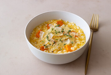 Risotto with pumpkin, cheese and thyme. Vegetarian food. Healthy eating.