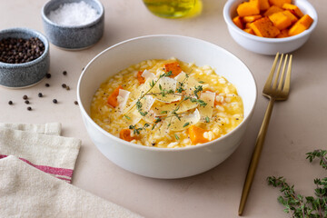 Risotto with pumpkin, cheese and thyme. Vegetarian food. Healthy eating.