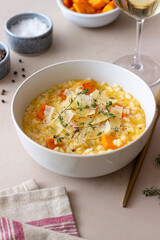 Risotto with pumpkin, cheese and thyme. Vegetarian food. Healthy eating.