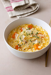Risotto with pumpkin, cheese and thyme. Vegetarian food. Healthy eating.