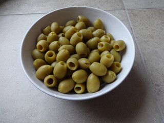 Green Olives without Pits in a White Bowl