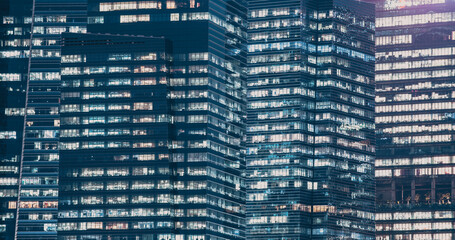 skyscrapers windows at night in Singapore