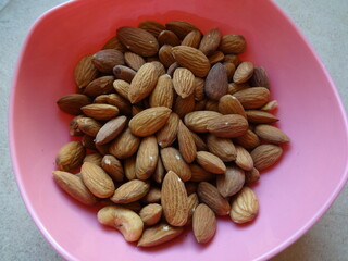 Almonds in a Pink Plastic Bowl