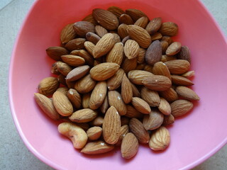 Almonds in a Pink Plastic Bowl