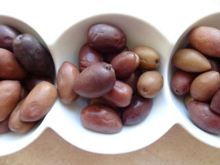 Greek Olives in a Modern White Ceramic Cup