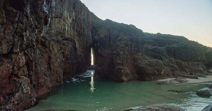 Zawn Pyg Natural Arch At Nanjizal Beach In Cornwall, England, UK - static shot