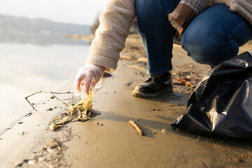 Detail of a dirty plastic bag found near water