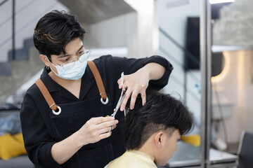 Hairdresser Cutting Customer Hair with Scissor