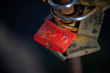 Romantic padlocks tied on a bridge.
