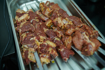 Raw meat on skewers