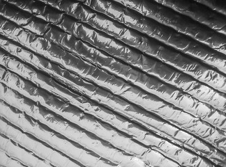 silver bubble wrap surface. plastic texture with air balls on the surface used for packing glassware or electronics or sensitive items