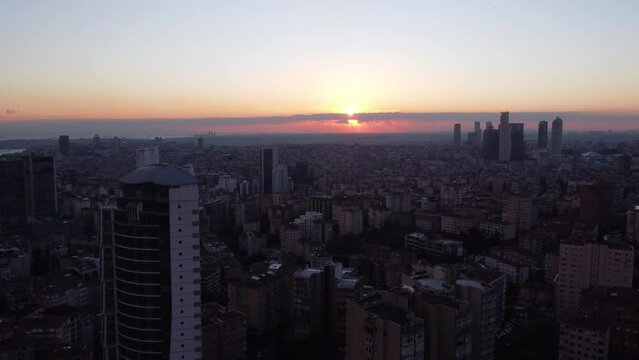 Sun setting in the horizon of Istanbul aerial shot