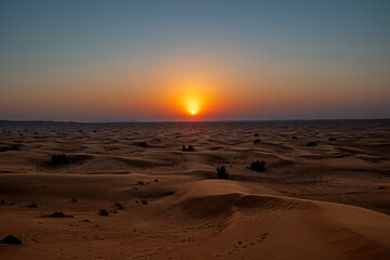 Sunset in the desert dunes of Dubai
