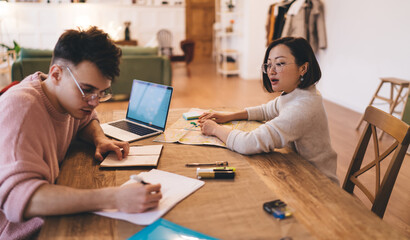 Couple planning vacation or journey at table