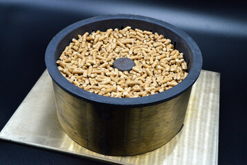 Pellet burner.  Perfect heating system, to be placed in a home fireplace or stove.