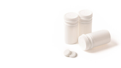 Fototapeta na wymiar white medicine jars on a white isolated background.