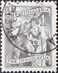 Yugoslavia - circa 1950: a postage stamp from Yugoslavia, showing a High voltage technician.