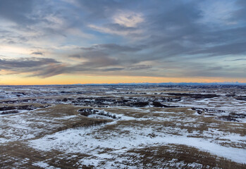 High aerial shot of the Alberta prairies during morning sunrise in Rocky View County Canada.