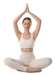  Beautiful young woman meditating on white background © New Africa