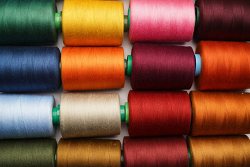 Colorful thread spool background, close-up