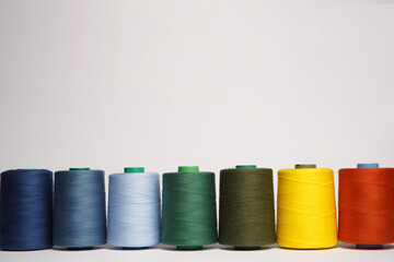 Colorful thread spool background, close-up