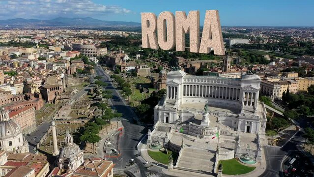 Roma scritto a caratteri cubitali sullo sfondo dell'Altare della Patria e del Colosseo.
Vista aerea della scriita "ROMA" in 3D sui fori Imperiali, sul Colosseo e sull'Altare della Patria.