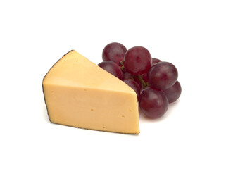 Piece of cheese and grapes isolated on white background