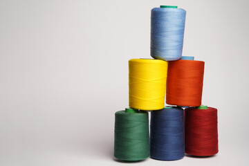 Colorful thread spool background, close-up