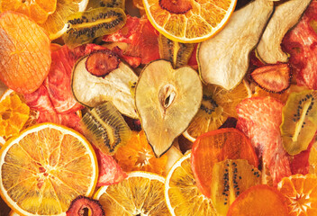 background from various multicolored dried fruits, top view