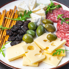 appetizer plate cheese, sausage, olives, bread sticks ready to eat fresh portion dietary healthy meal food diet still life snack on the table copy space food background rustic top view