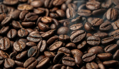 Hot smoky coffee beans background. Close Up.                          