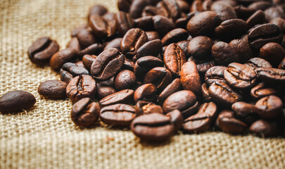 Roasted coffee beans placed on a sack