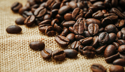Roasted coffee beans placed on a sack	