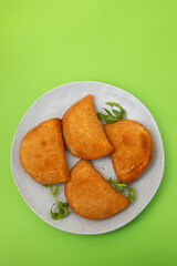typical portuguese appetizer rissois de carne on plate