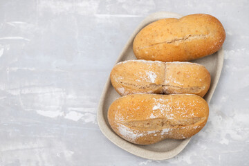 fresh bread in small dish on yellow paper