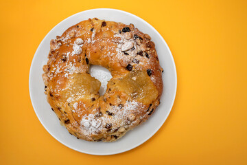 typical portuguese fruit cake Bolo rainha on white dish