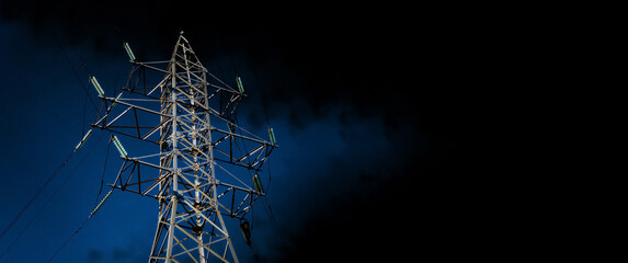 High voltage pole over cloudy sky, electricity price increase concept, panoramic layout