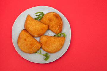 typical portuguese appetizer rissois de carne on plate