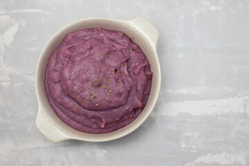 mashed sweet potato in the bowl on ceramic