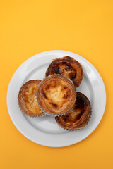 typical portuguese dessert pastel de nata on plate