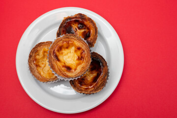 typical portuguese dessert pastel de nata on plate